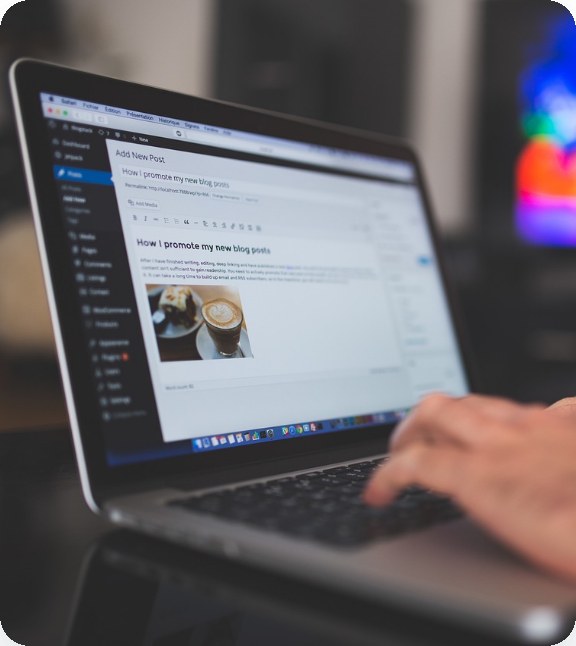 Developer editing a WordPress post on a laptop